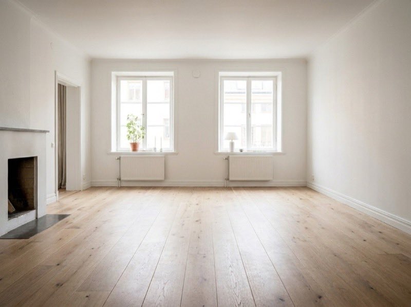 Bright minimalist room with light wood floors